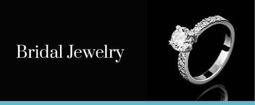 The text Bridal Jewelry to the left of a fancy wedding ring against a black background.