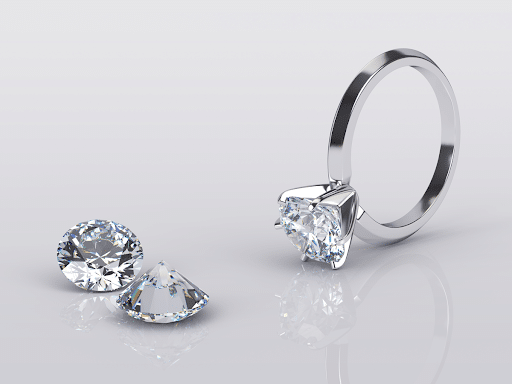 loose diamonds next to diamond ring